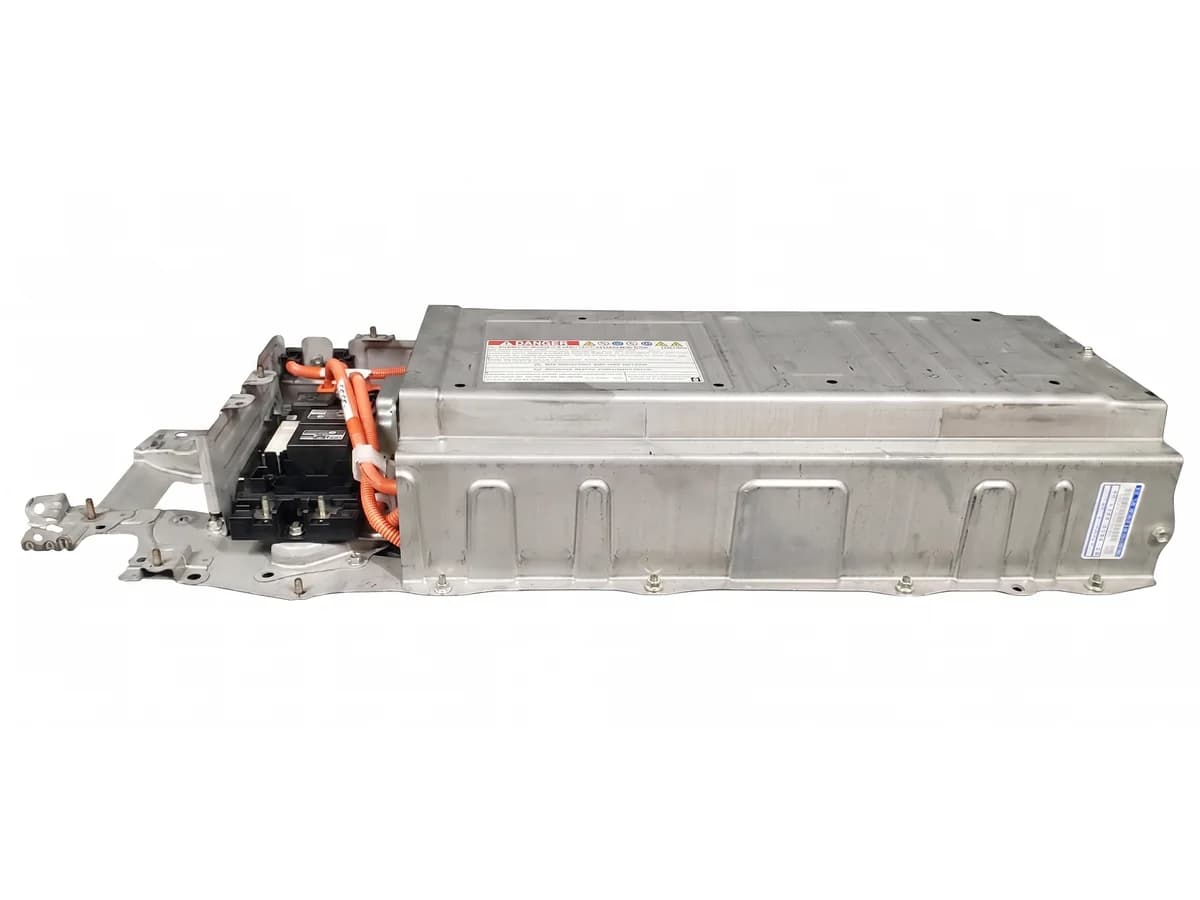 Technician rebuilding a hybrid battery